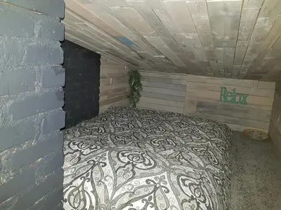 a bedroom with a bed in a brick wall at Dp Art 14 OLD TOWN Self check in in Kaunas