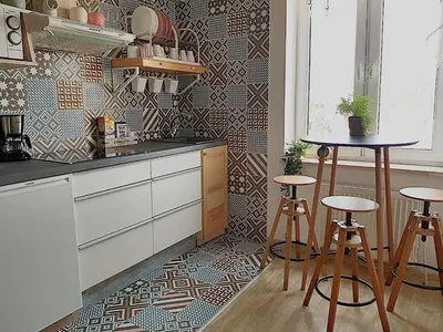 a kitchen with two stools and a table in it at Dp Art 14 OLD TOWN Self check in in Kaunas