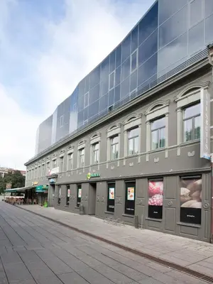a large building on the side of a street at Kaunas City in Kaunas