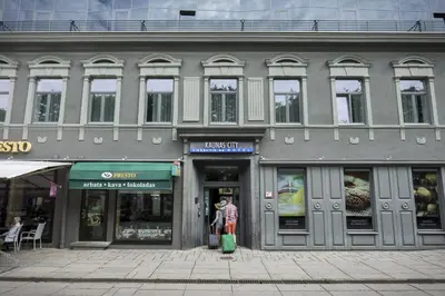 a woman standing in the doorway of a building at Kaunas City in Kaunas