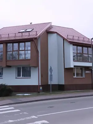 a building on the side of a street at Apartamentai Birštono centre su židiniu in Birštonas