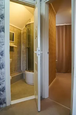 a bathroom with a walk in shower and a tub at Apartamentai Birštono centre su židiniu in Birštonas