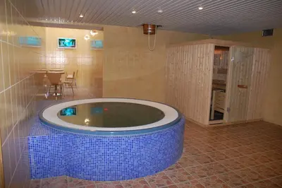 a large bathroom with a tub in a room at Hotel-Restaurant Smilga in Kėdainiai