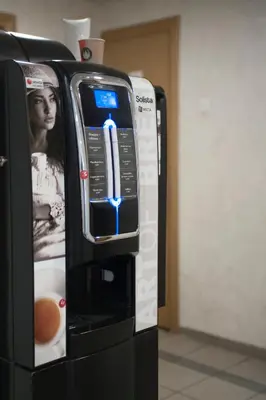 a black vending machine with a cell phone on it at Savan House 