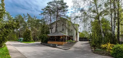 a house with a gazebo in front of it at Apartamentai Laima in Druskininkai
