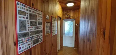 a hallway with pictures on the walls of a house at ApartHotel SAVAS 2 Apartments in Kaunas and parking in Kaunas