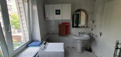 a small bathroom with a sink and a mirror at ApartHotel SAVAS 2 Apartments in Kaunas and parking in Kaunas