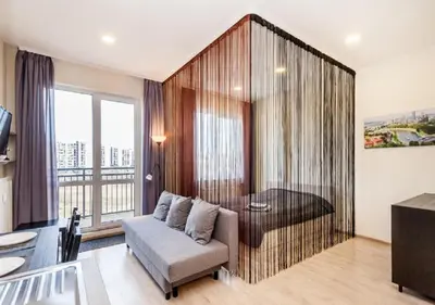 a living room with a couch and a table at Apartamentai 