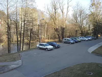 a bunch of cars parked in a parking lot at Lima Studio in Druskininkai
