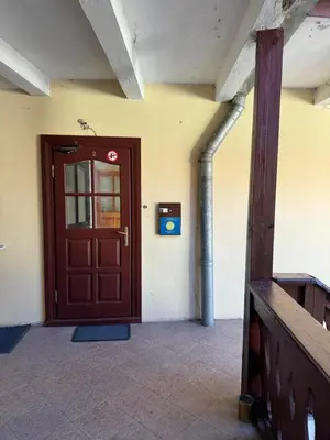 a wooden door in a room with at Tilto 6 in Vilnius