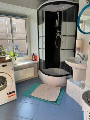 a bathroom with a shower and a sink at Tilto 6 in Vilnius
