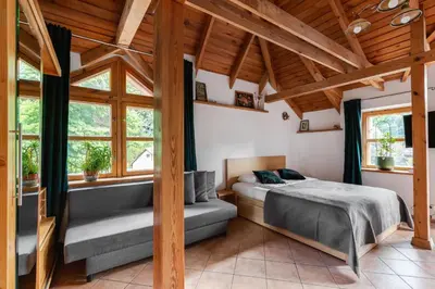 a bedroom with a bed and a window at House of Sun in Vilnius