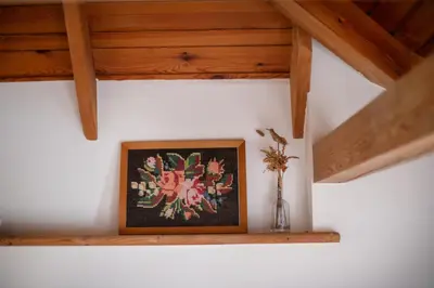 a picture sitting on a shelf in a room at House of Sun in Vilnius