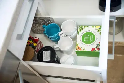 a drawer with some food items in a refrigerator at Stay in Kaunas - Free Parking in Kaunas
