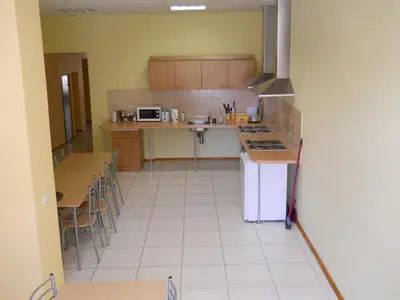 a kitchen with a sink and a counter top at Fortuna Hostel in Vilnius
