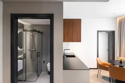 a bathroom with a shower and a sink at Pan Tadeusz in Vilnius