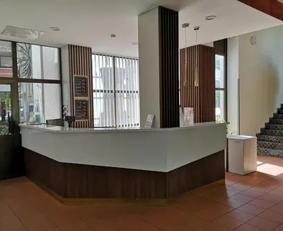 a lobby of a building with a reception counter at Pan Tadeusz in Vilnius
