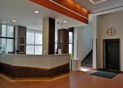 a lobby with a reception desk in a building at Pan Tadeusz in Vilnius