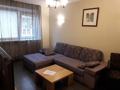 a living room with a couch and a table at Laisves al. 7 in Kaunas