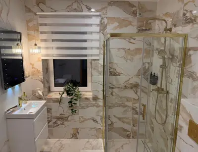 a bathroom with a shower and a sink at Simona House in Šiauliai