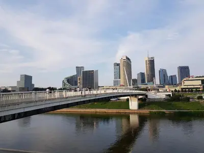 a bridge over a river with a city in the background at Natalex Europe in Vilnius