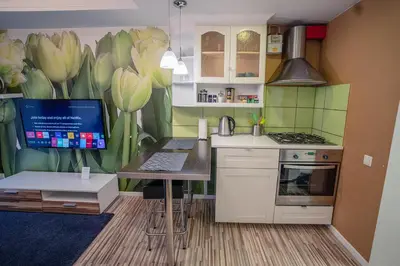 a kitchen with a desk with a computer on it at Alpetri Apartments in Kaunas