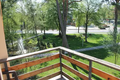 a balcony with a view of a park at Hotel Dainava in Druskininkai