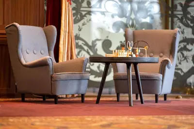 two chairs and a table in a room at Harmony Park Hotel & SPA in Prienai