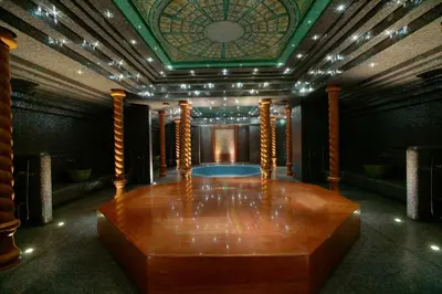 a room with a large wooden floor and a ceiling at Harmony Park Hotel & SPA in Prienai