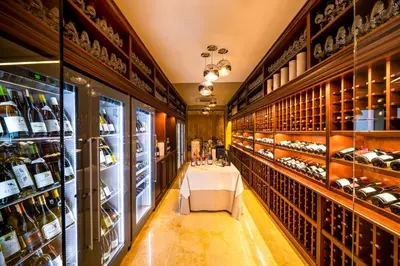 a wine tasting room with a table in the middle at Harmony Park Hotel & SPA in Prienai