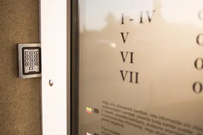 a door with a sign that reads ivy vs wii at Verslo Klasė-easy to stay in Panevėžys