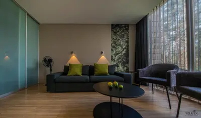 a living room with a couch and a table at TonyResort in Trakai