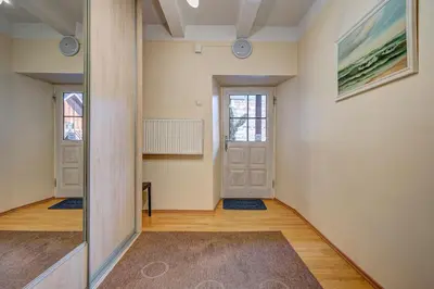 an empty hallway with a door in a room at Vidos apartamentai 2 in Vilnius