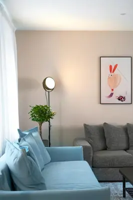 a living room with a couch and a table at Kaunas Old Town Apartment in Kaunas