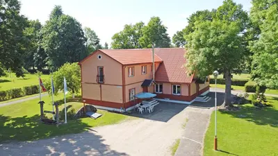 an aerial view of a small house in a park at 
