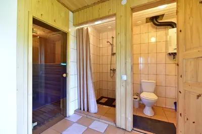 a bathroom with a shower and a toilet in it at 