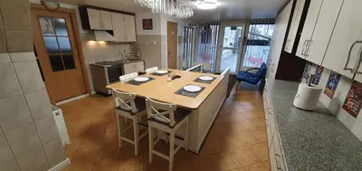 a kitchen with a island in the middle of a room at ApartHotel SAVAS 4 Private house with parking in Kaunas