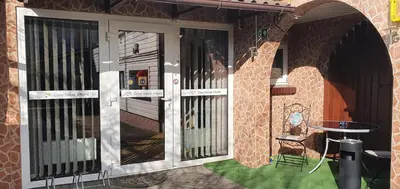 a front door of a house with a table in front at ApartHotel SAVAS 4 Private house with parking in Kaunas