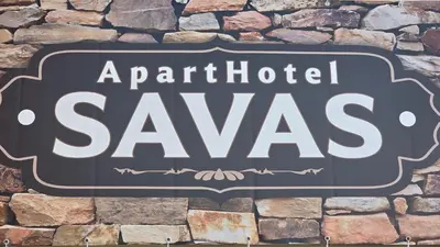 a sign that reads artificial savas on a stone wall at ApartHotel SAVAS 4 Private house with parking in Kaunas