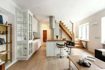 a kitchen with a counter and some chairs in a room at #stayhere 3BDR Modern & Stylish Apartment - Heart of Old Town by Houseys in Vilnius