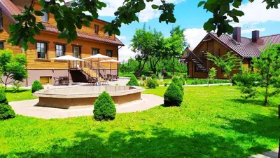 a house with a bench in the middle of a yard at 