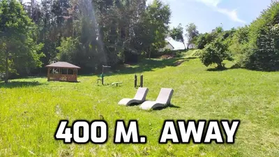 a sign that says zoo masy in a field at 
