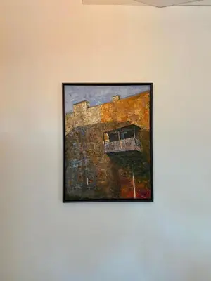 a painting of a building on a wall at Jolie Apartments in Kaunas