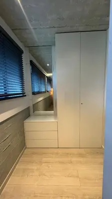 an empty room with two windows and a wooden floor at Modern and spacious loft type apartment 8 with free private parking by 