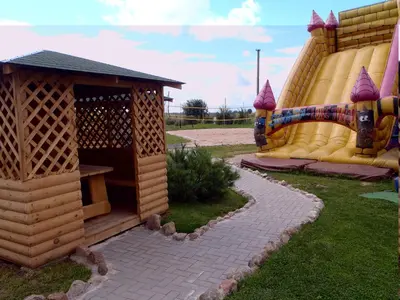 a playground with a slide and a play structure at Geltona in Šiauliai