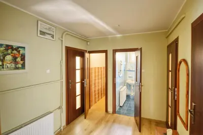 a hallway with two doors and a bathroom at Poilsis Pas Tada in Druskininkai
