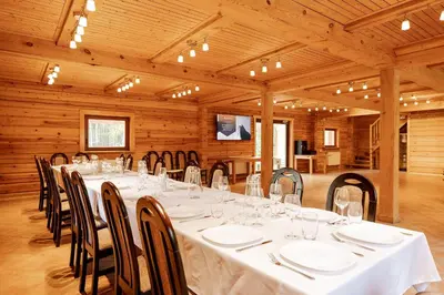 a large room with a long table and chairs at House of Sparkles in Elektrėnai