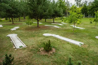 an overhead view of an empty park with trees at Senelio Romo Sodyba in Molėtai