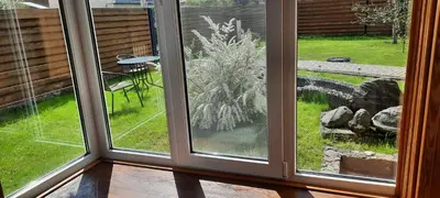 a window with a view of a garden outside at Verkių Namelis in Vilnius
