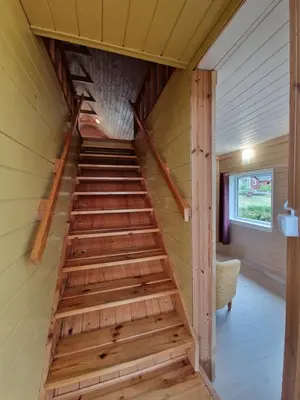 a staircase in a tiny house at Sodyba Dubinga in Molėtai